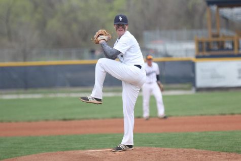 En route to a 10-4 victory, junior pitcher Branden Rader prepares to throw the first pitch of the second inning on Thursday, April 11.