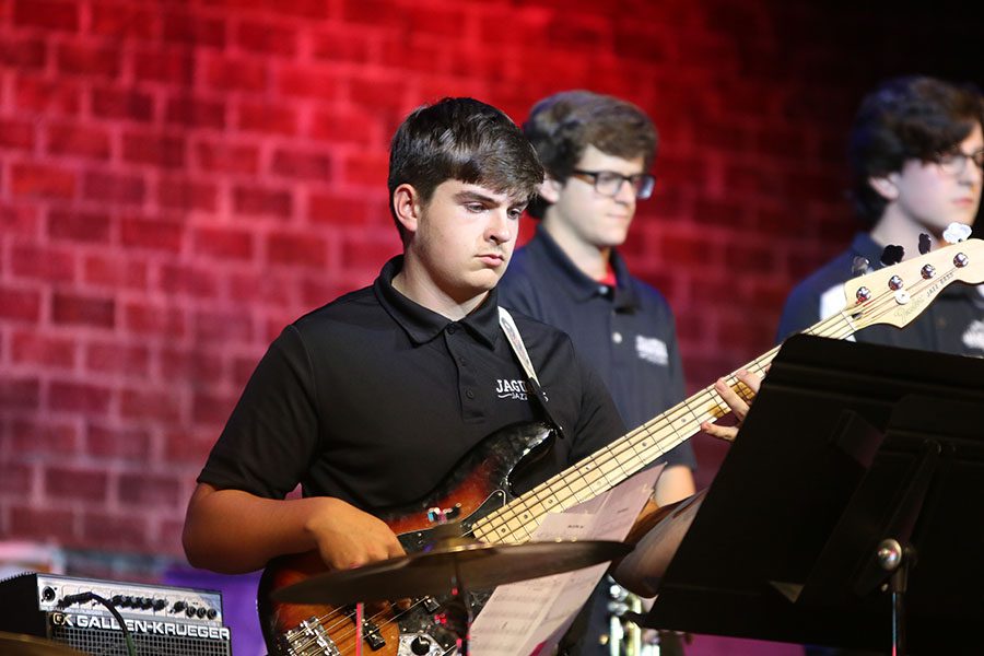 Sophomore Devin Kuhlman strums the bass guitar.