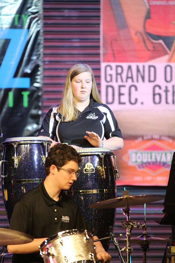 Junior Abby Lee plays the drums during the performance