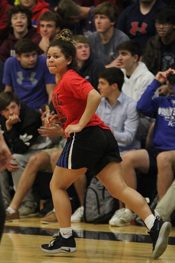 Playing in the Student vs. Faculty game on Tuesday, April 30, senior Presley Barton runs down the court.