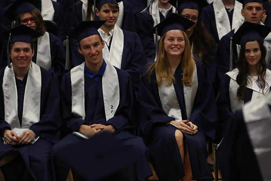 Seniors Jake Ashford and Amber Auckly laugh at a joke in a speech.