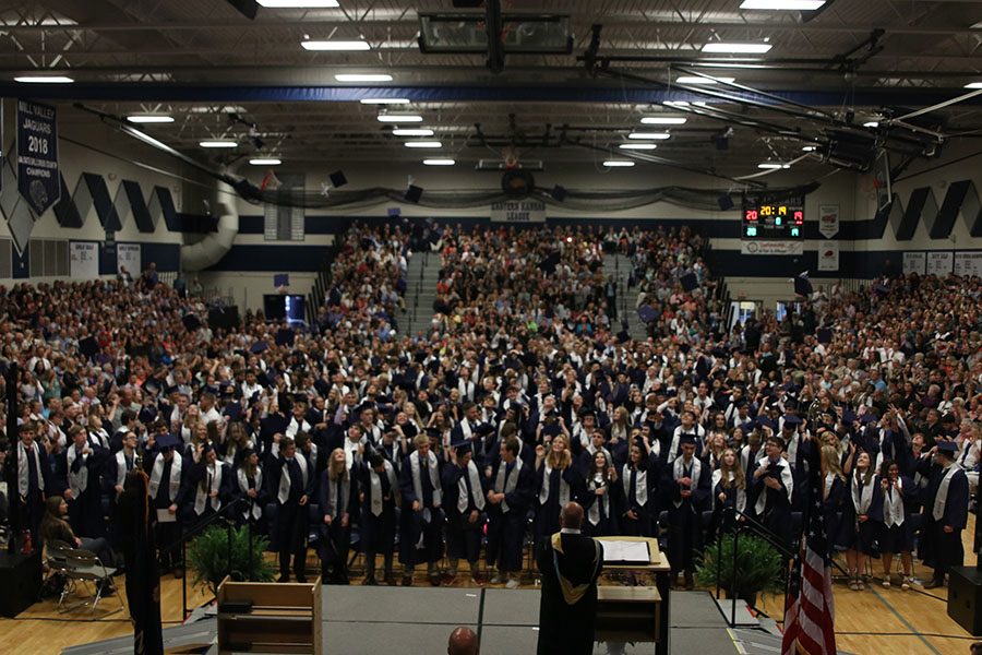 The seniors celebrate their graduation with the hat toss.