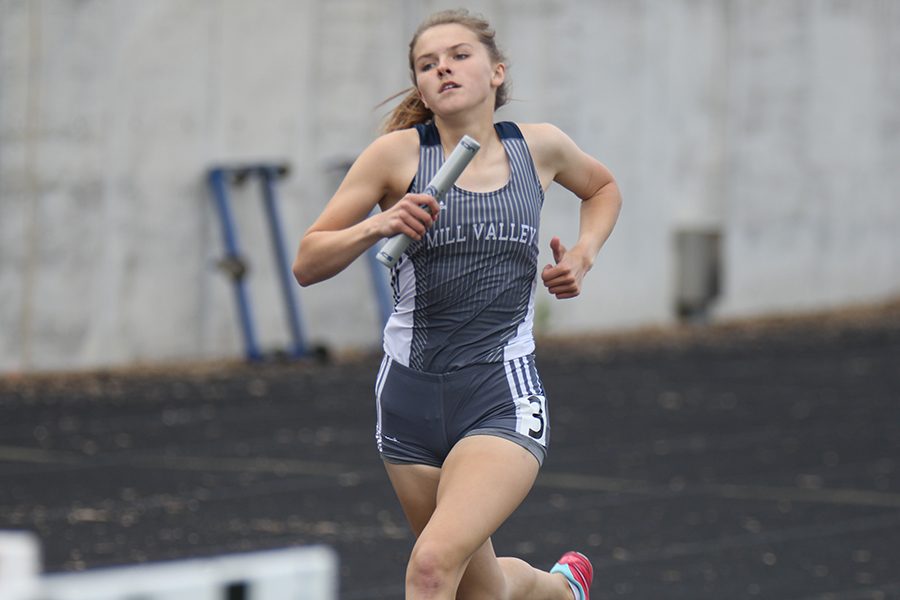 Finishing the 4x8 relay, sophomore Megan Haymaker sprints to the finish line. 