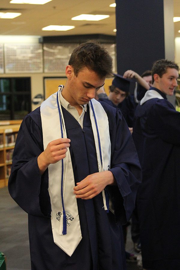 Seniors get ready for graduation ceremony in the Media Center. 