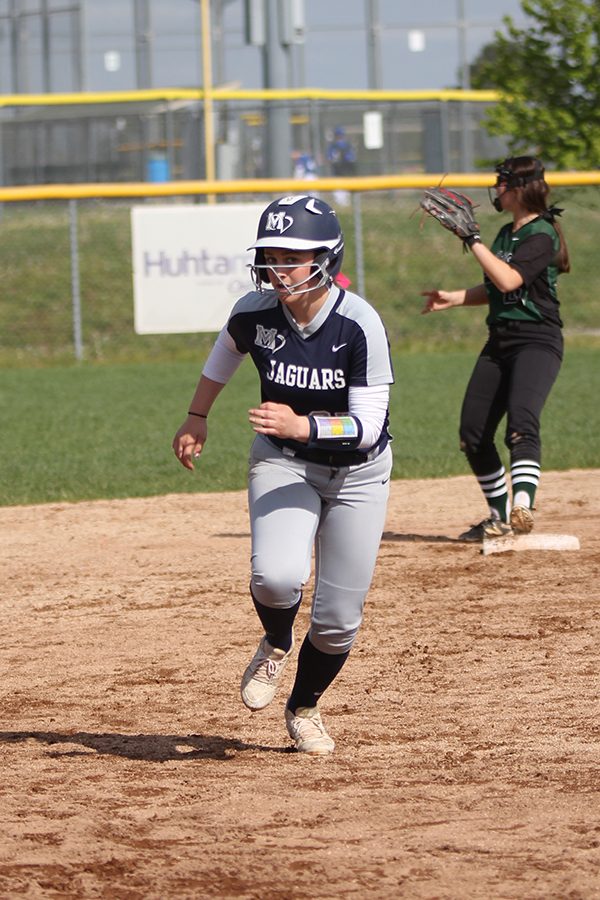 Running off of second base, sophomore Abby Burke runs to third base. 