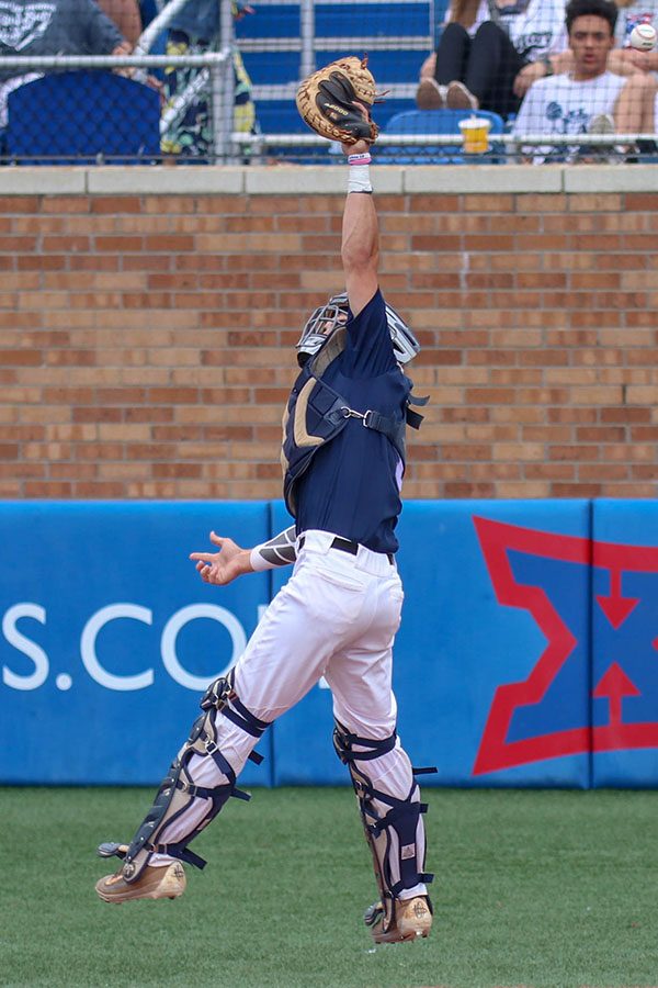 Trying to catch a high ball, senior Ethan Judd jumps, Friday, May 24. 
