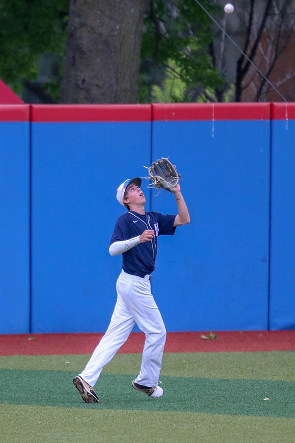 Looking towards the ball, senior Matt Smith lines up to catch the pop fly, Friday, May 24. 