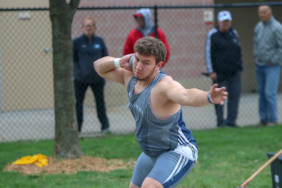 Focusing on his form, senior Christian Roth prepares to throw the shot put. Roth placed 6th in the shot put. 