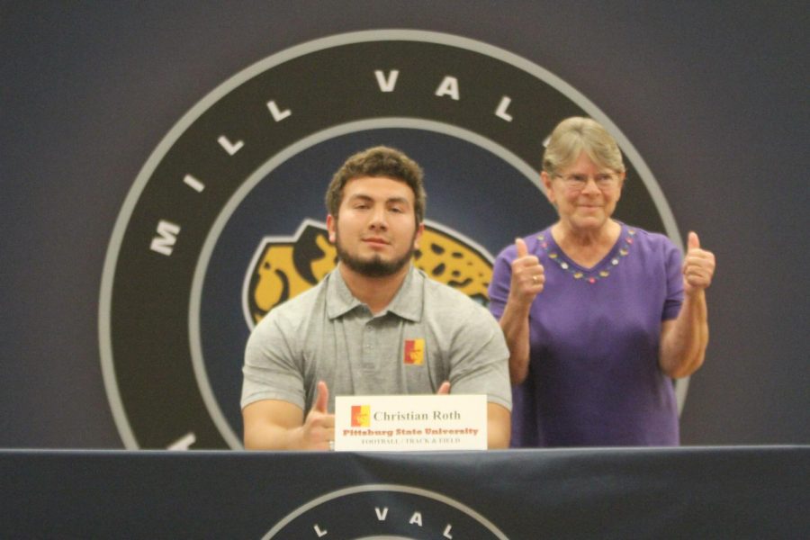 After signing to play football and compete in track and field at Pittsburg State University, Christian Roth smiles with his grandmother.
