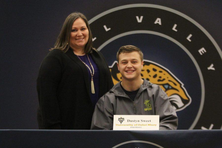 After signing to play football at University of St Mary, Dustyn Sweet smiles with his mother.