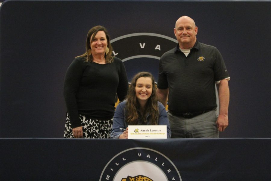 After signing to play golf at Wichita State University, Sarah Lawson smiles with her parents.