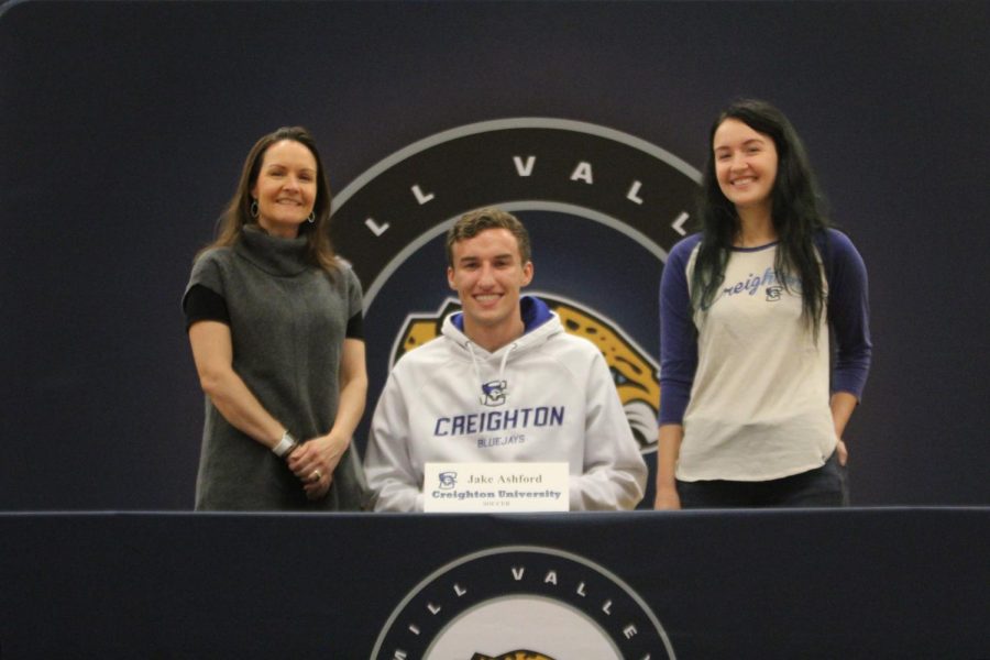 After signing to play soccer at Creighton University, Jake Ashford smiles with his family.