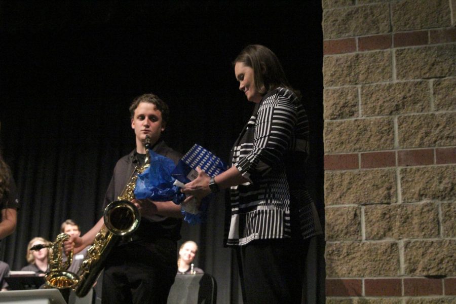 After a Jazz Band concert on Tuesday, April 30, band director Deb Steiner opens a gift from senior saxophonist Marah. The gift was on behalf of the rest of the Jazz Band as a thank you to Steiner.