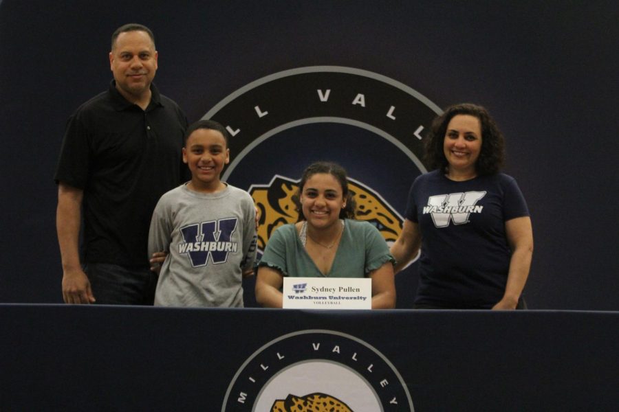 After signing to play Volleyball at Washburn University, Sydney Pullen smiles with her family.
