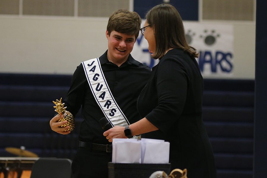 Winning the first annual Spirit of the Band award, senior Zach Bossert embraces Steiner for an appreciation hug.