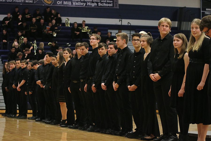 Making a line across the gym, seniors face the audience to be recognized for their band accomplishments.