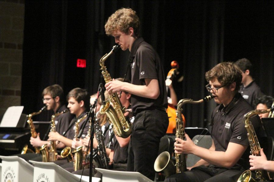 During a Jazz Band concert Tuesday, April 30, sophomore John Fraka plays a solo on his saxophone during the song Teaneck.