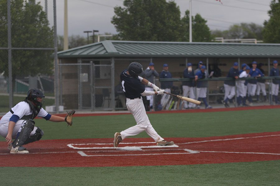 Looking at the ball, senior Ethan Judd gets ready to swing his bat.