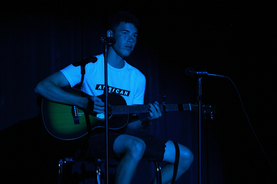 Singing the song “When You Love Someone”, senior Eric Shanker performs a guitar and vocal solo at the talent show on Thursday, May 2.