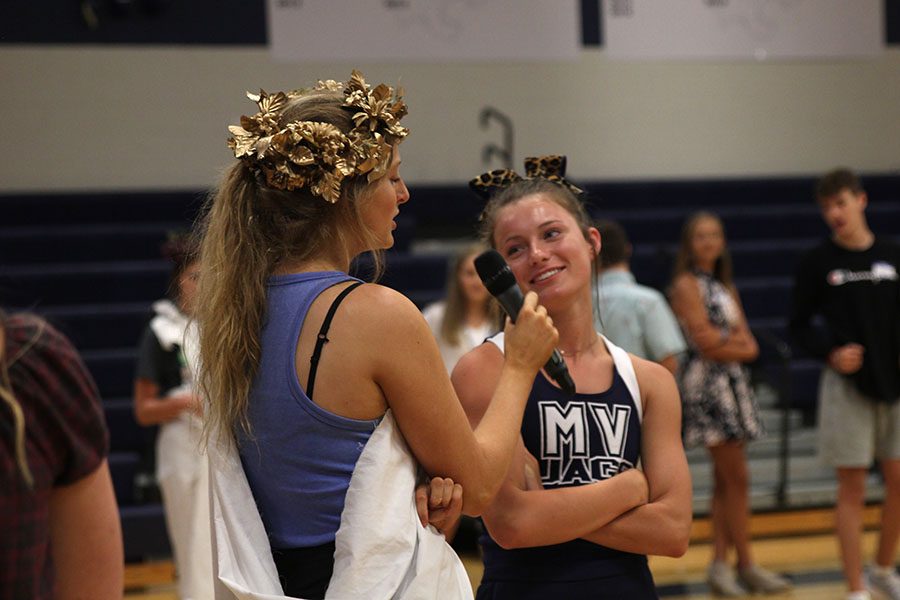 Senior Annie Bogart talks to freshman Dylan Dedrickson during an icebreaker game.
