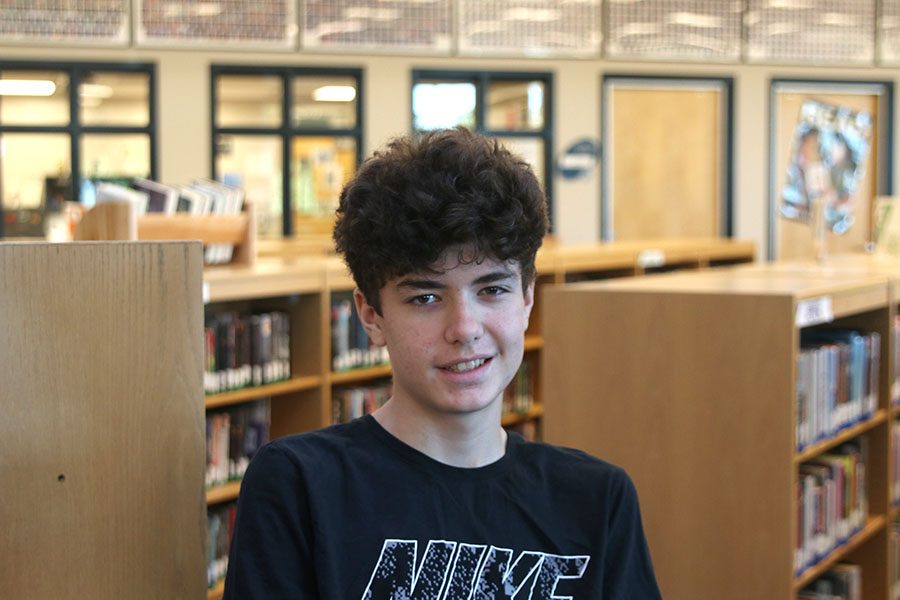 Student tech Collin Mckinnon helps students and teachers get a hang of the new MacBooks