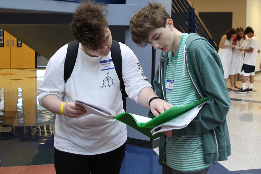 Incoming freshman Xander Shields helps fellow incoming freshman Noah Basso find his class. 