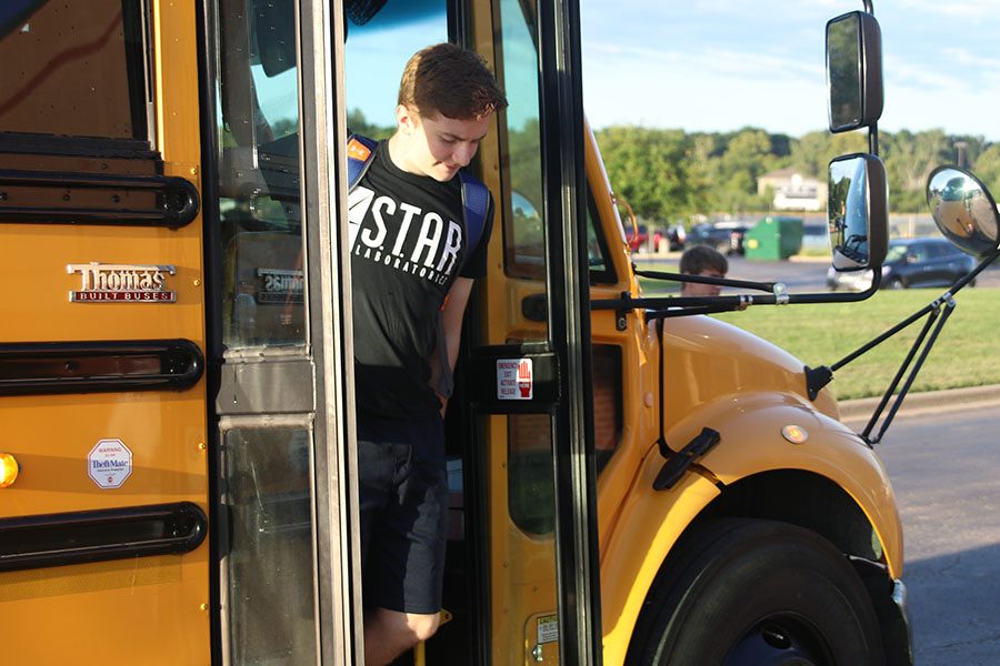 Getting off the bus, sophomore Jakob Patterson heads towards the ground level entrance of the school because the front entrance has been blocked off.
