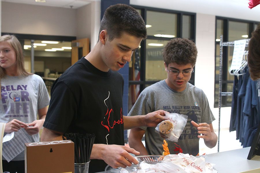 After paying, senior Gage Overbeck picks out his cookie of choice.
