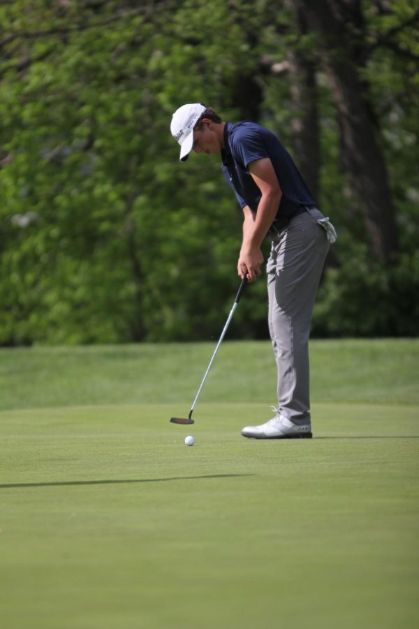 Junior Nick Mason watches his putt roll towards the hole at the Ironhouse Invitational Wednesday May 6, 2019. Mason is still deciding where he will commit.

