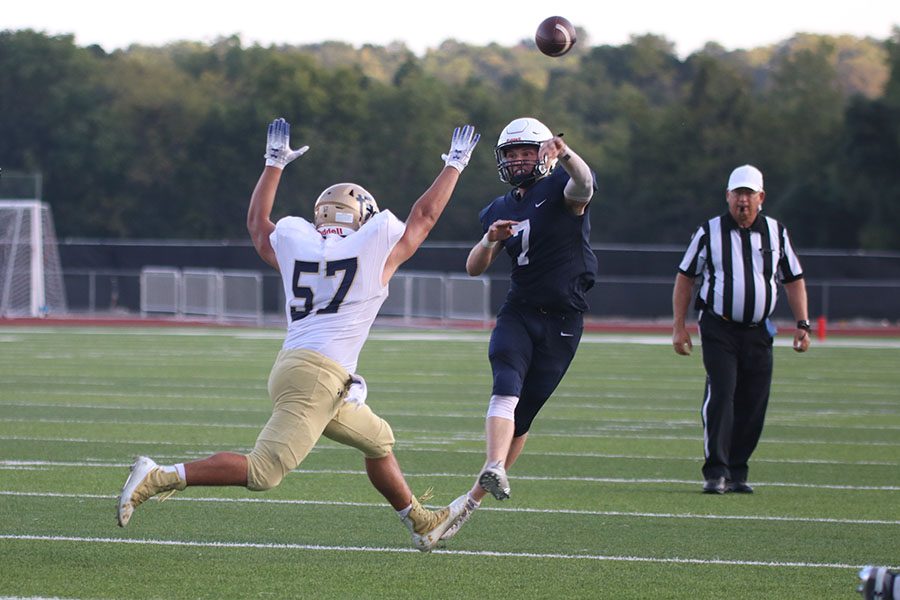 Seeing an opportunity near the end zone, quarterback Cooper Marsh throws the ball to an open teammate during the game against St. Thomas Aquinas on Friday, Sept. 27.