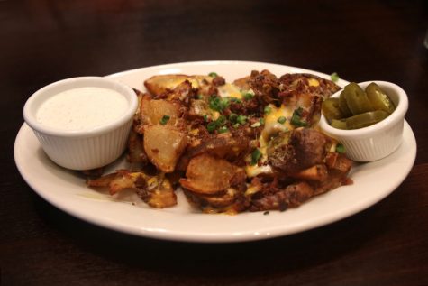 Among seven other selections of Jakes Starters, the Irish Nachos — a crowd favorite — features crispy fried potatoes topped with melted cheese, bacon bits, diced green onions with a side of ranch and jalapeños.