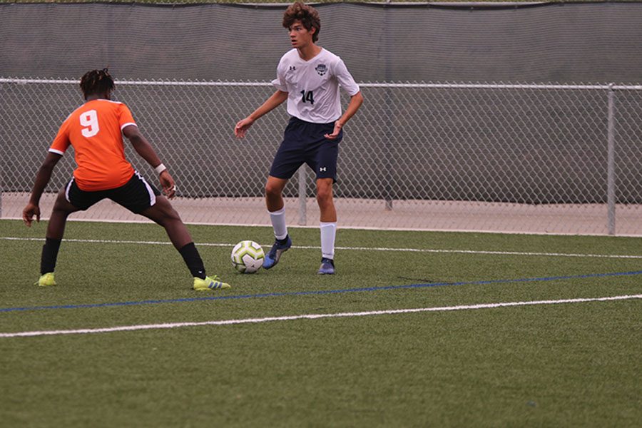 Studying the field, junior Luke Kappes-Sum decides what to do.