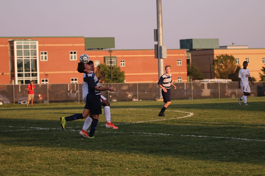 After goalkeeper Colin Riley punts the ball down the field, sophomore Yahel Anderson receives the ball with his head. 