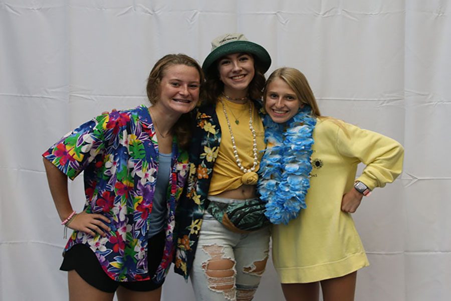 Striking a pose, sophomores Lauren Walker, Maddy Williams, and Bridget Roy smile with their Hawaiian gear on. 