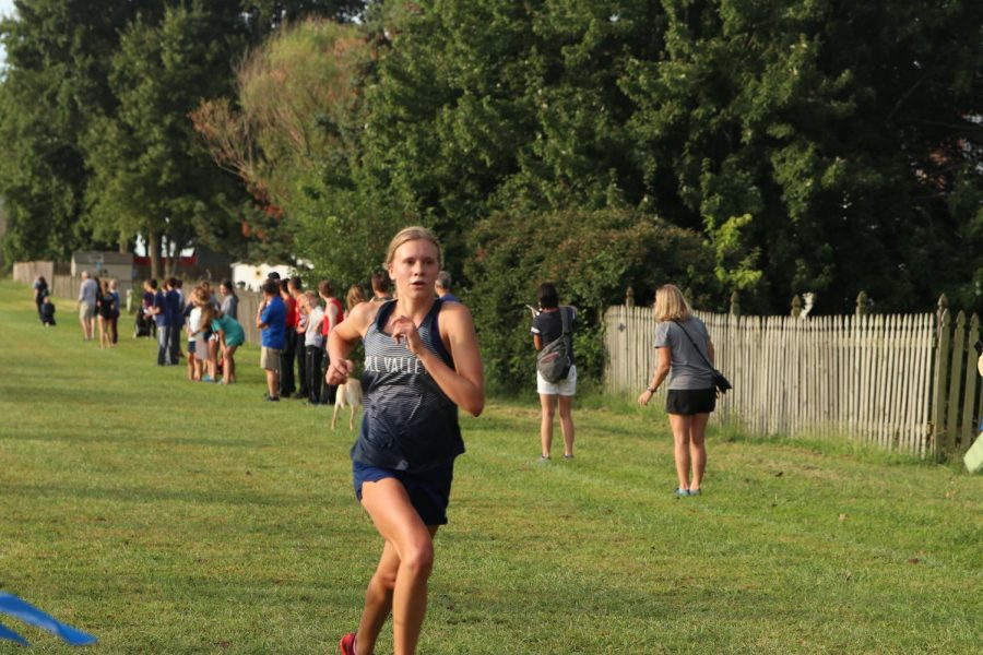 Sprinting to finish the race, sophomore Katie Schwartzkopf picks up the pace to end strong.

