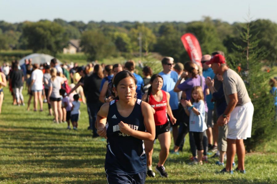 Pacing herself throughout the course, sophomore Amy Hill keeps at the halfway point.
