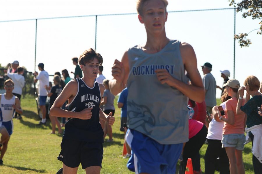 Speeding up, sophomore Chase Schieber is about to pass his opponent from Rockhurst.