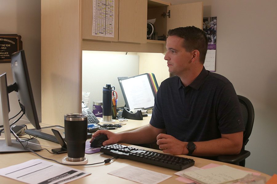 After the construction got rid of his office window, school counselor Chris Wallace has to work in the dark.
