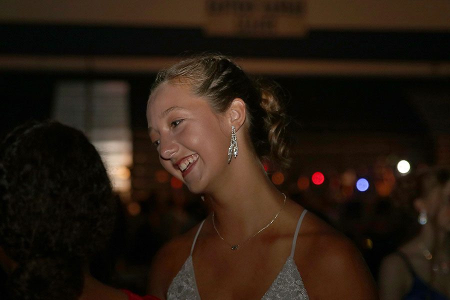 Freshman Carli Dupriest socializes with friends at the dance.