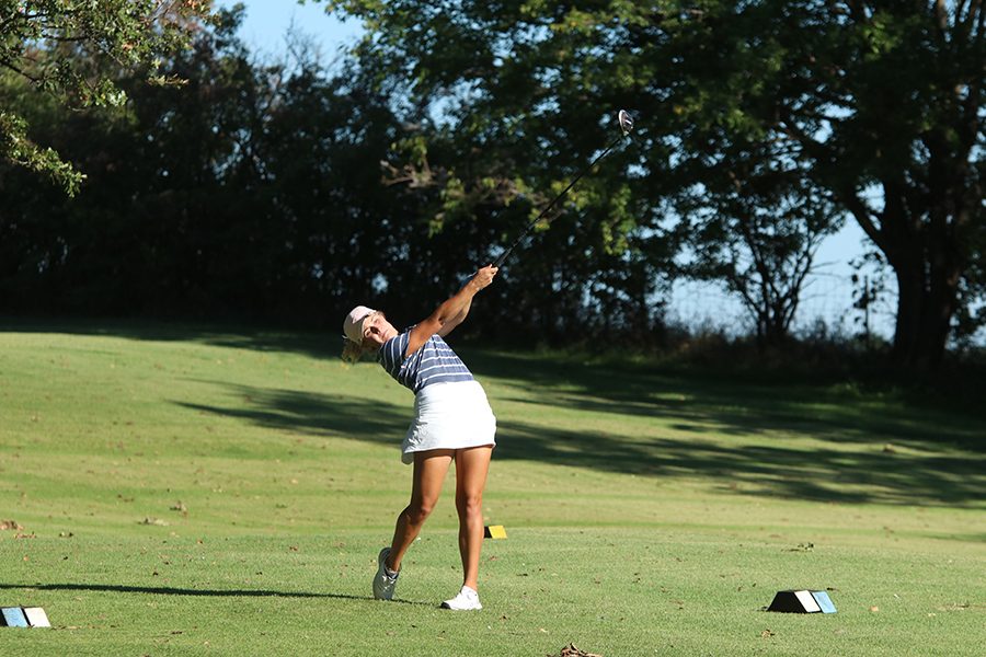 With her driver, senior Hannah Davie tees off.