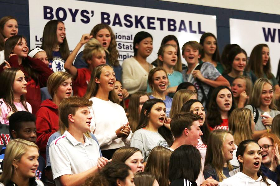 Finishing off the pep rally, students stand up to chant the last cheer.