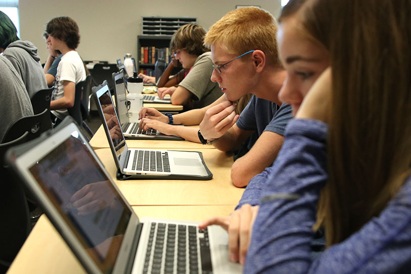 Taking his test in AP U.S. History on Tuesday, Sept. 3, junior John Lehan uses the application Canvas on his new MacBook.
