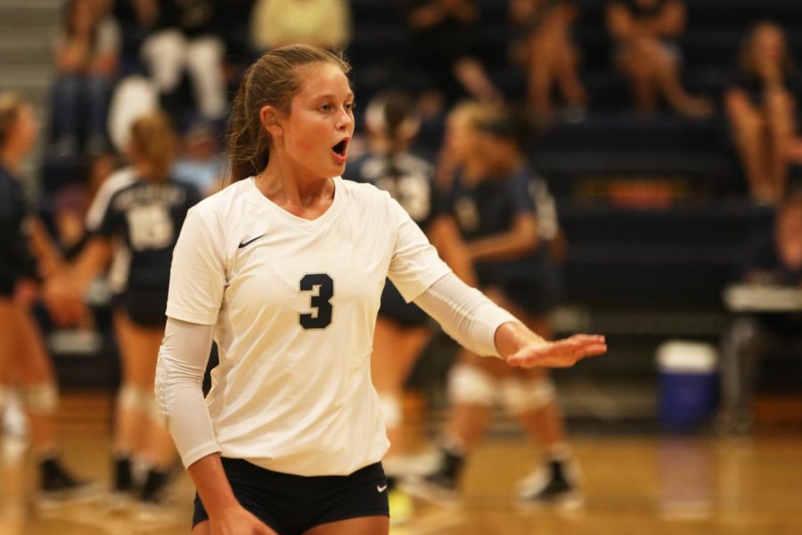 With an outstretched hand, junior Jaden Ravnsborg gets the attention of her teammates.
