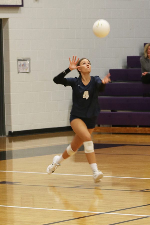 Preparing to serve, senior Emma Fox concentrates on the ball on Tuesday, Sept. 10.