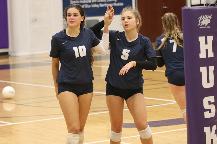 During a pause in the set, junior Molly Carr prepares to sub in for junior Anna Judd.