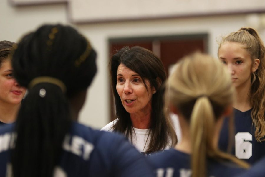 After winning the match against Blue Valley North West with a winning score of 3-2, Coach Fay speaks to the team.