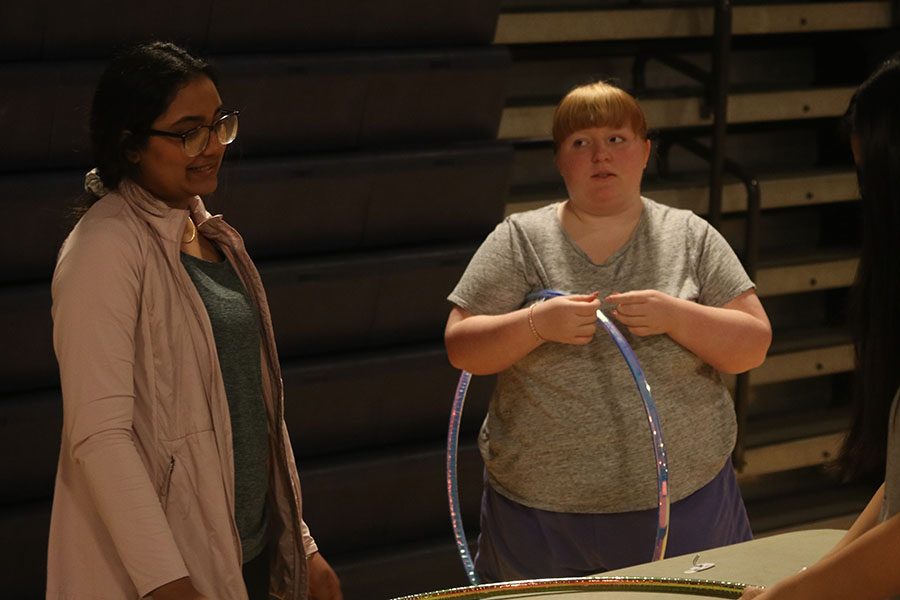 Junior Ashleen Toor and Senior Chloe Griffin discuss how to set up decorations.