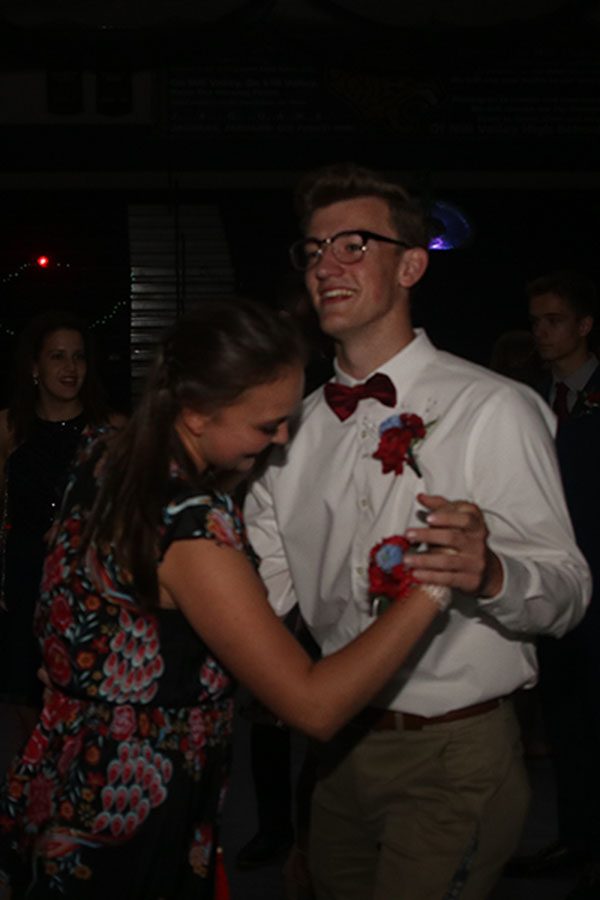 Junior Audrey Hereth waltzes with junior Gabe Holgate.