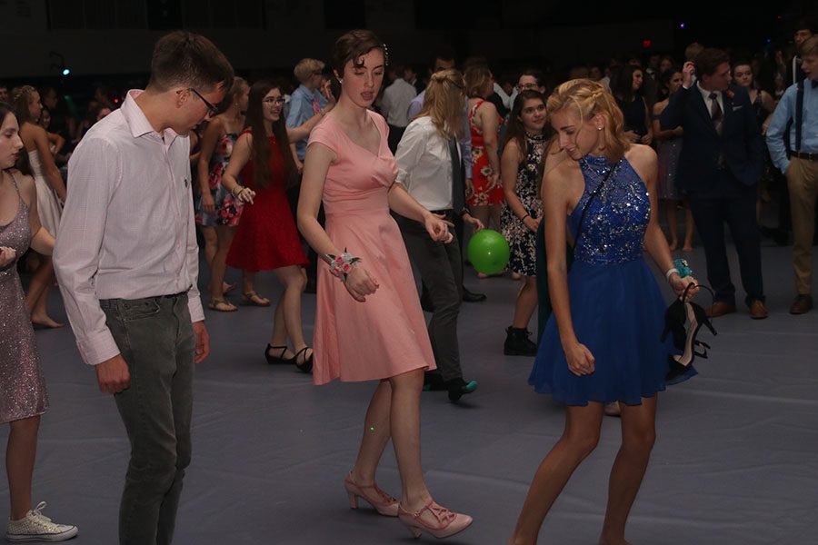 Sophomore Julianne Long dances in a line dance with friends.