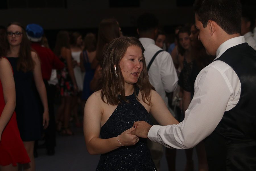 Dancing, senior Lauren ONeal speaks to her dance partner.